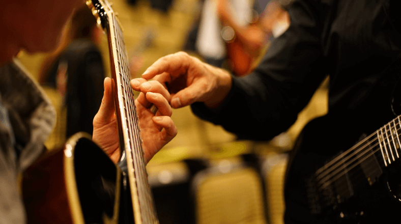 Teaching guitar at students' homes