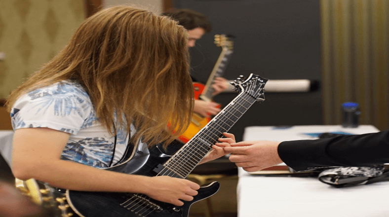 Teach guitar effectively