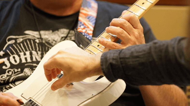 Play pinch harmonics