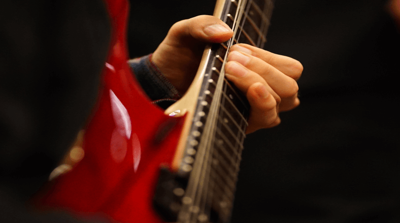 Play guitar solos that grab people