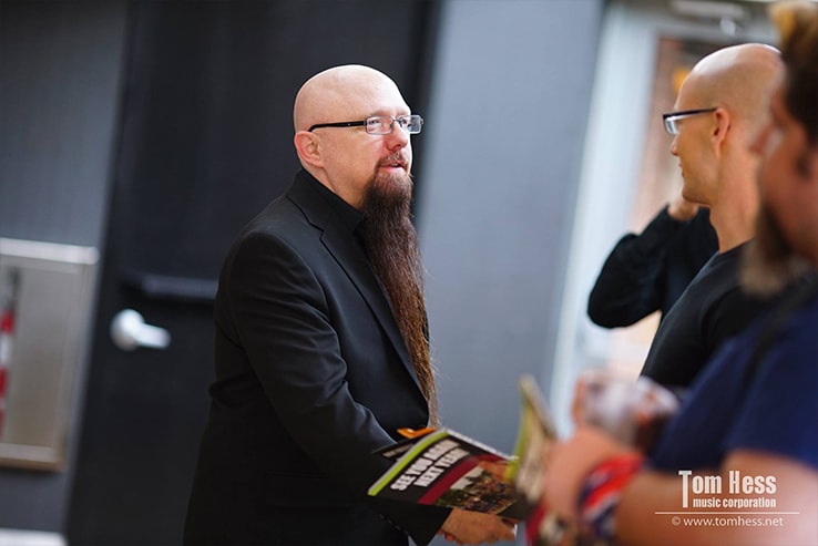 Tom Hess greeting the event's attendees