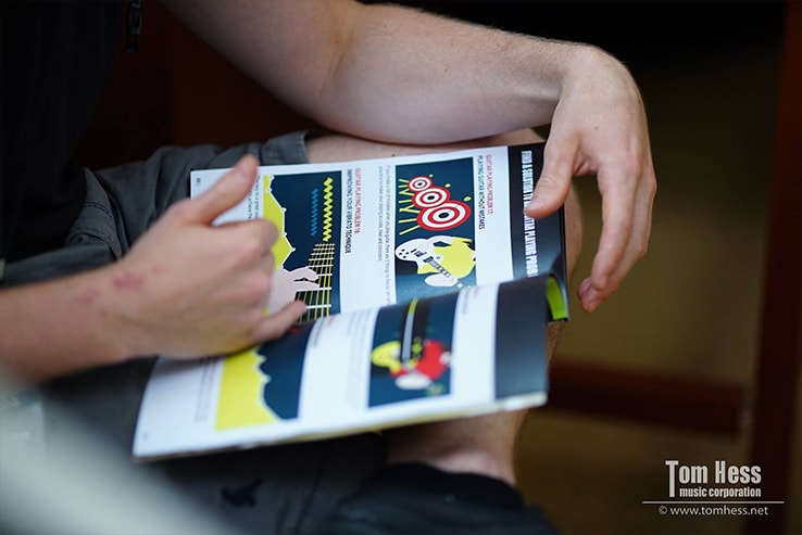 Binder with learning materials for guitar teachers