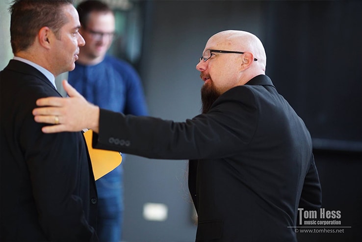 Tom Hess with a guitar teacher