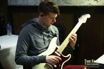 Compose a song on guitar