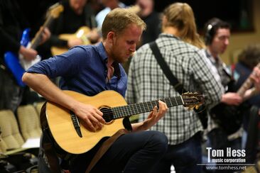 Play a song on acoustic guitar
