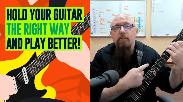 How to hold guitar